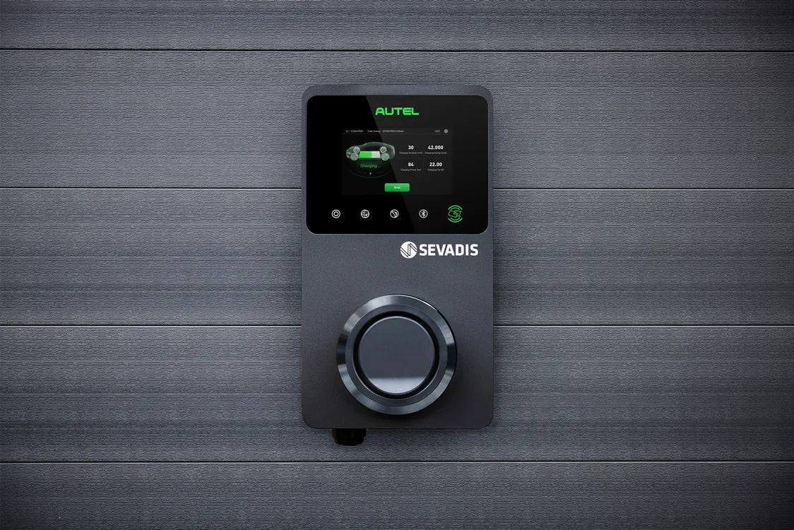 Autel MaxiCharger EV charger mounted on wood panel wall, SEVADIS display showing active charging session - UK home charging point