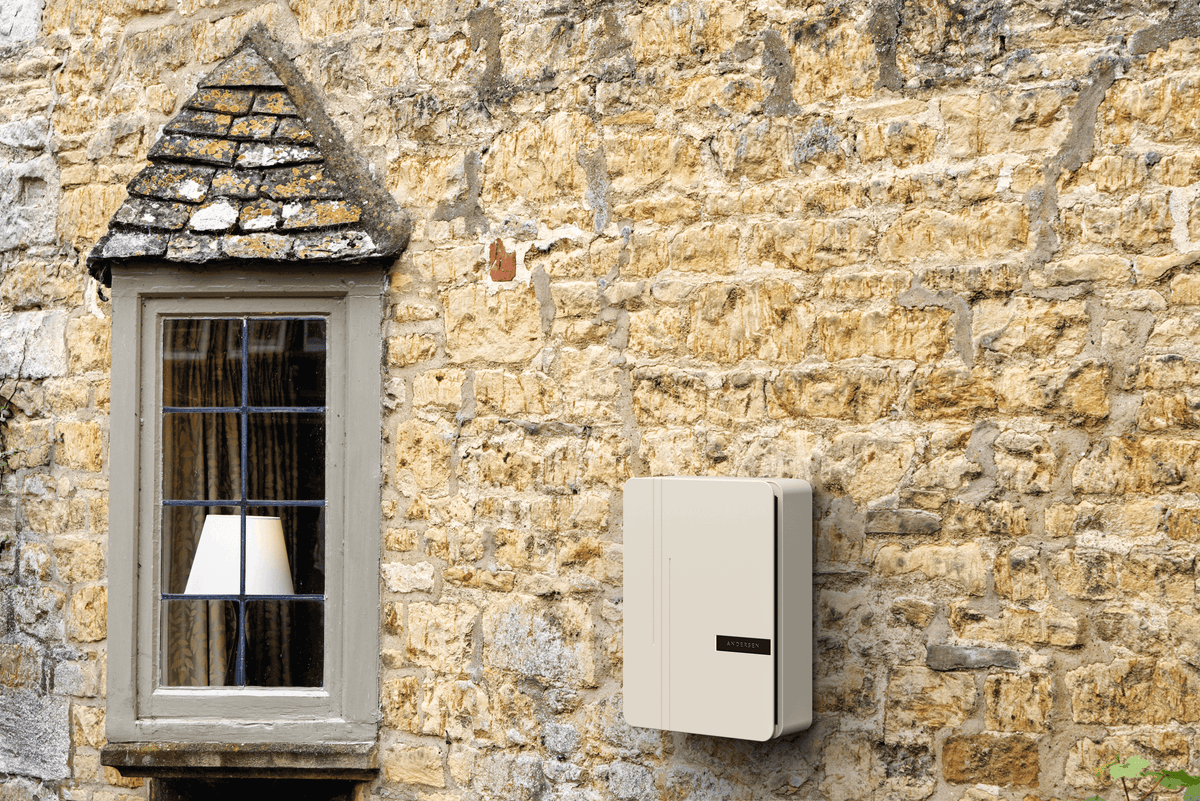 Cream EV charger installed on stone cottage wall - buy home charging station