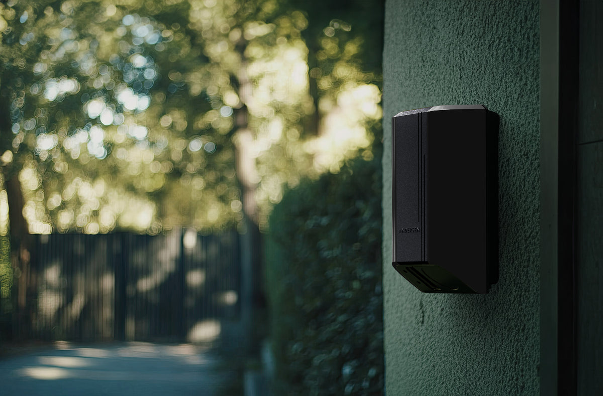 Andersen A3 EV charger in graphite black installed on garden wall - buy premium home charging point
