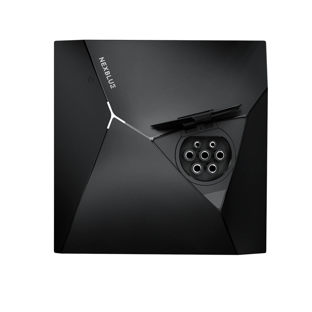 NexBlue Point home EV charger in matte black with faceted angular body, NEXBLUE wordmark and open Type 2 socket showing pinhole pattern inside triangular recess