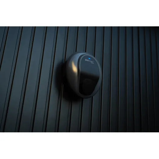 Pod Point Solo 3S EV charger in black, close-up on dark slatted wall with blue ambient lighting - UK home charging point