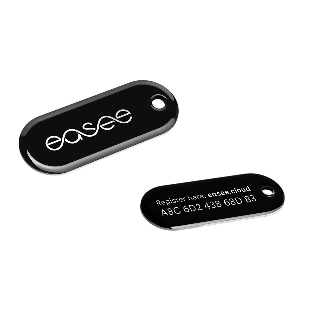 Two Easee RFID key fobs in glossy black, one showing embossed easee logo and the other showing the easee.cloud registration code on reverse