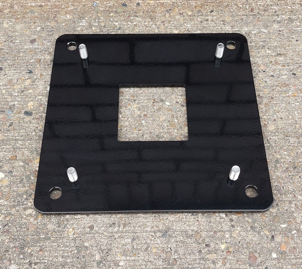 EV block mini pedestal black metal floor mounting base plate with bolt holes on concrete surface