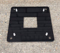 EV block mini pedestal black metal floor mounting base plate with bolt holes on concrete surface