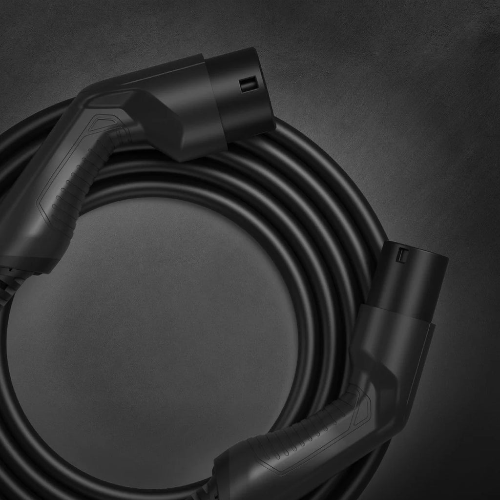 Type 2 to Type 2 EV charging cable coiled in black with male and female Mennekes connectors on dark grey background