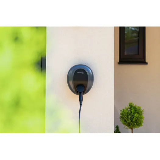 Pod Point Solo 3S 7kW EV charger, black tethered wall-mounted unit installed on exterior house wall - UK home charging point