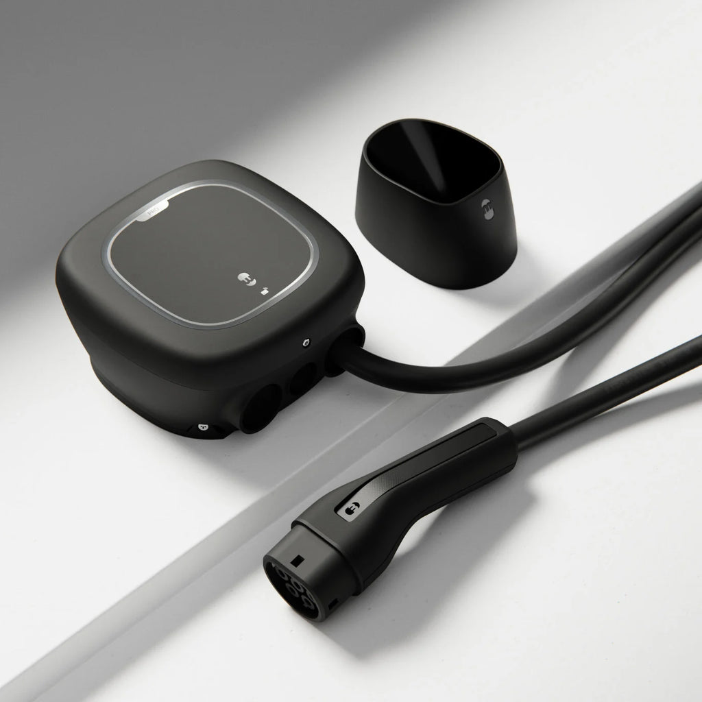 Wallbox Pulsar Pro 22kW EV charger three-quarter view with detached Type 2 connector and cable cup beside the rounded square body