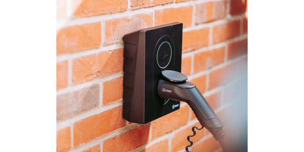 Zaptec Go EV Charger Wall-Mounted on Brick Wall - Home EV Charging Station