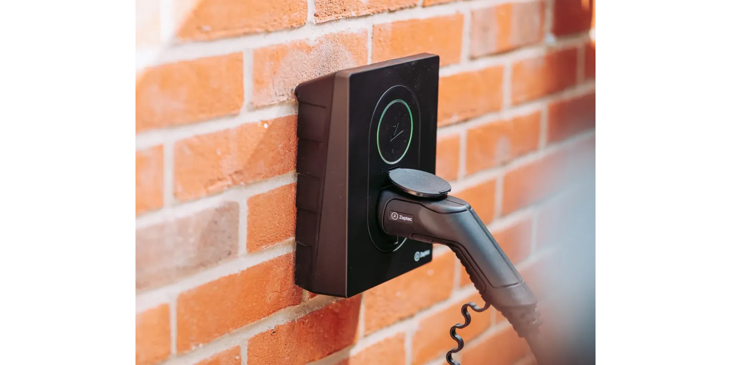 Zaptec Go EV Charger Wall-Mounted on Brick Wall - Home EV Charging Station